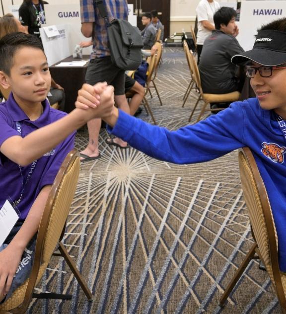 2 students shake hands