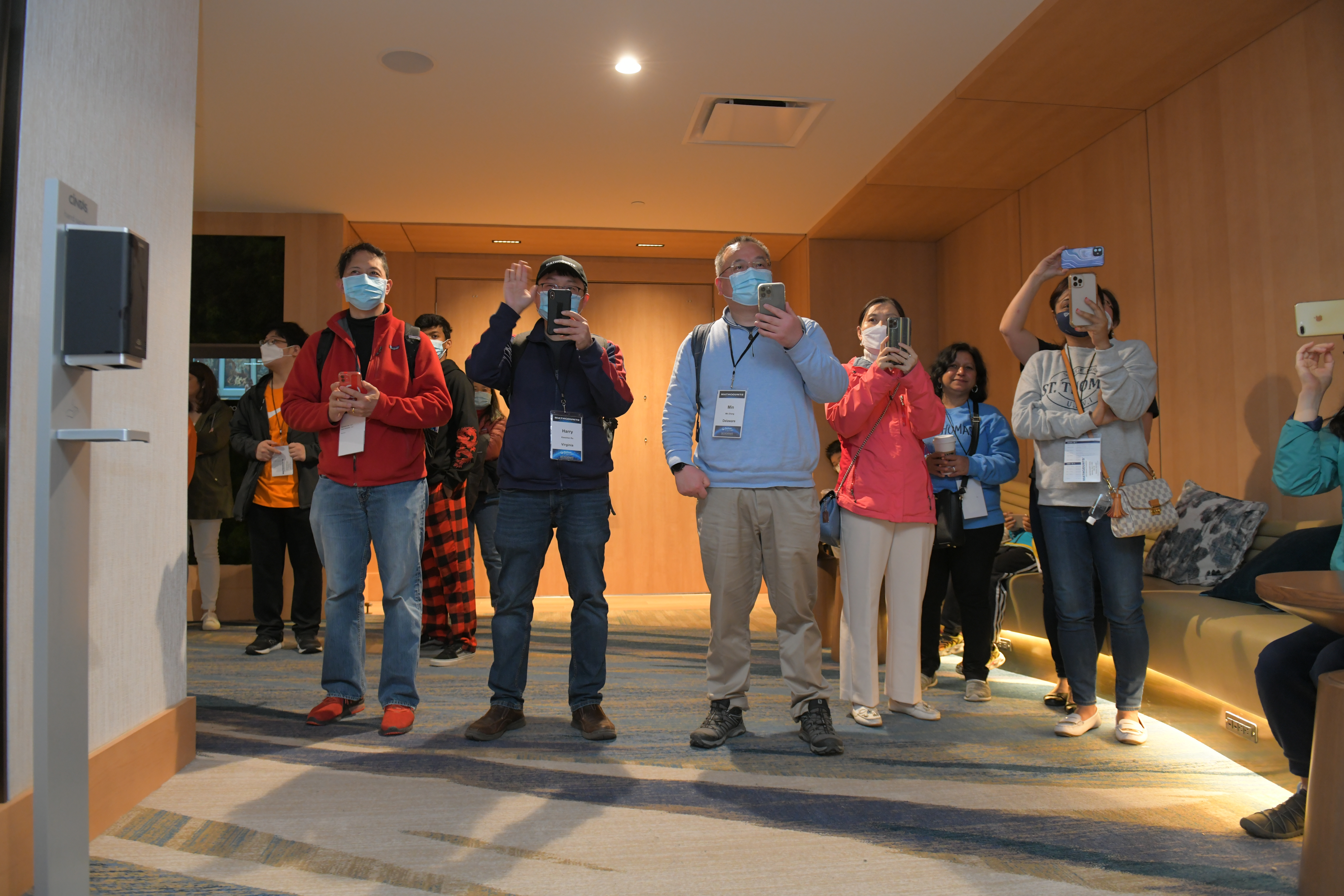 Parents take photos of Mathletes at the 2022 National Competition