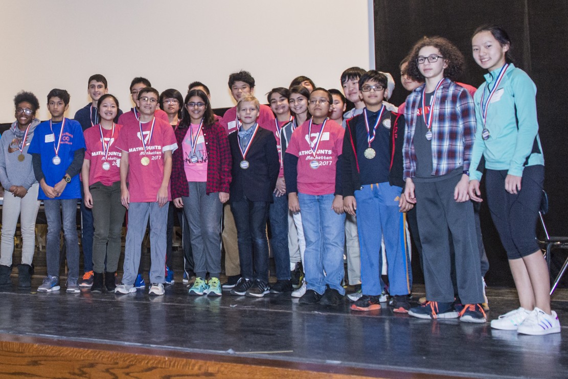 a group of students with medals