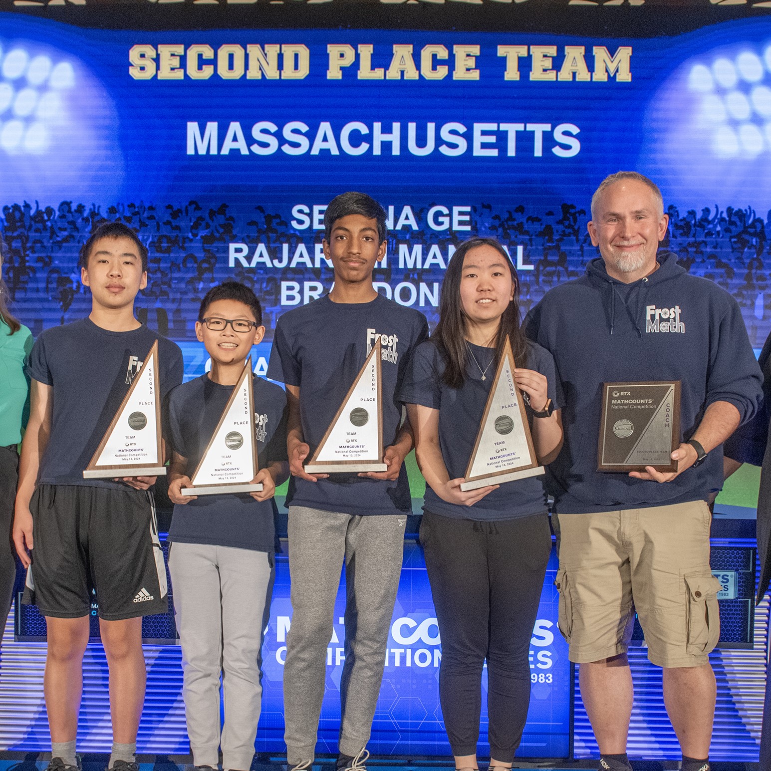 Massachusetts team onstage with their trophies
