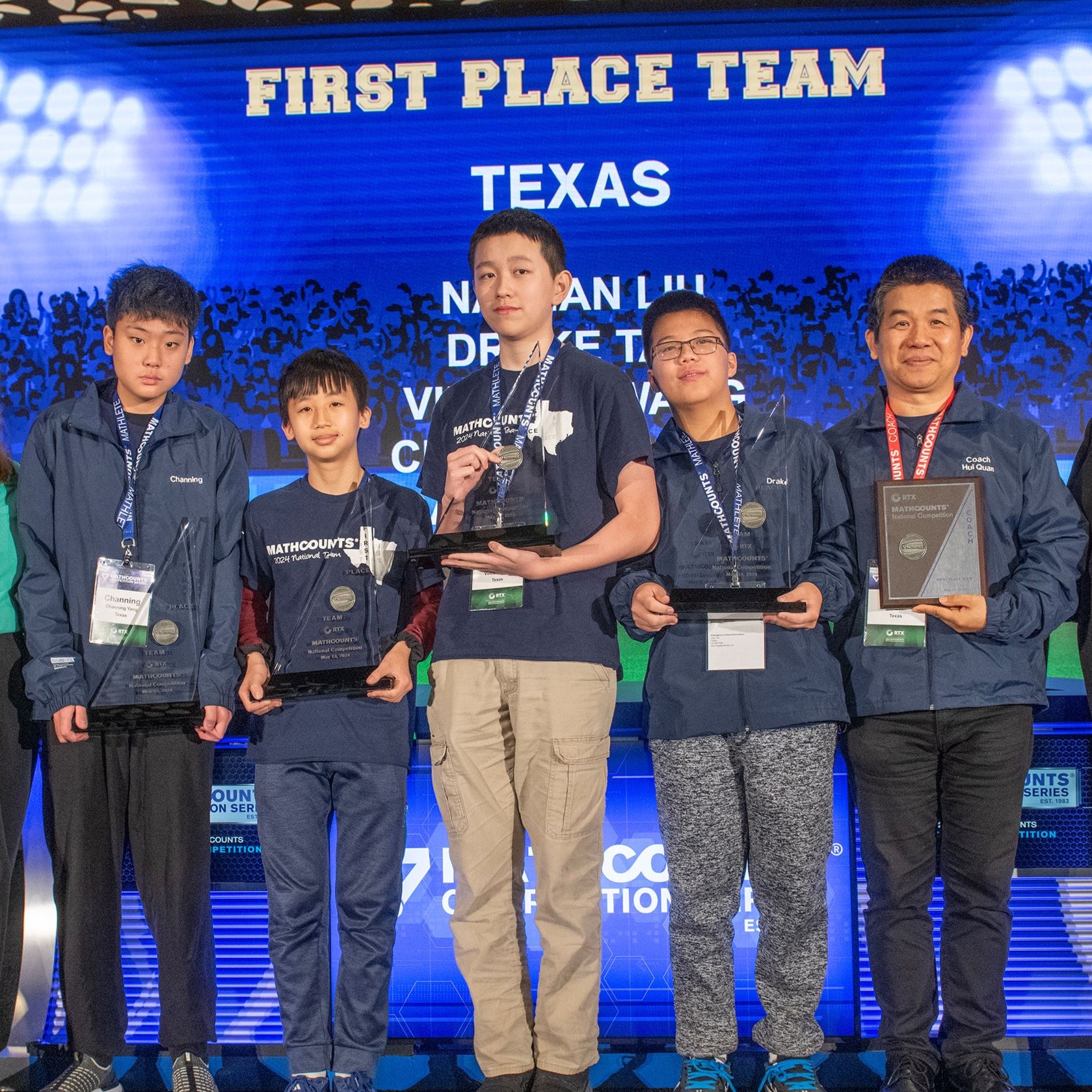 Texas team onstage with their trophies