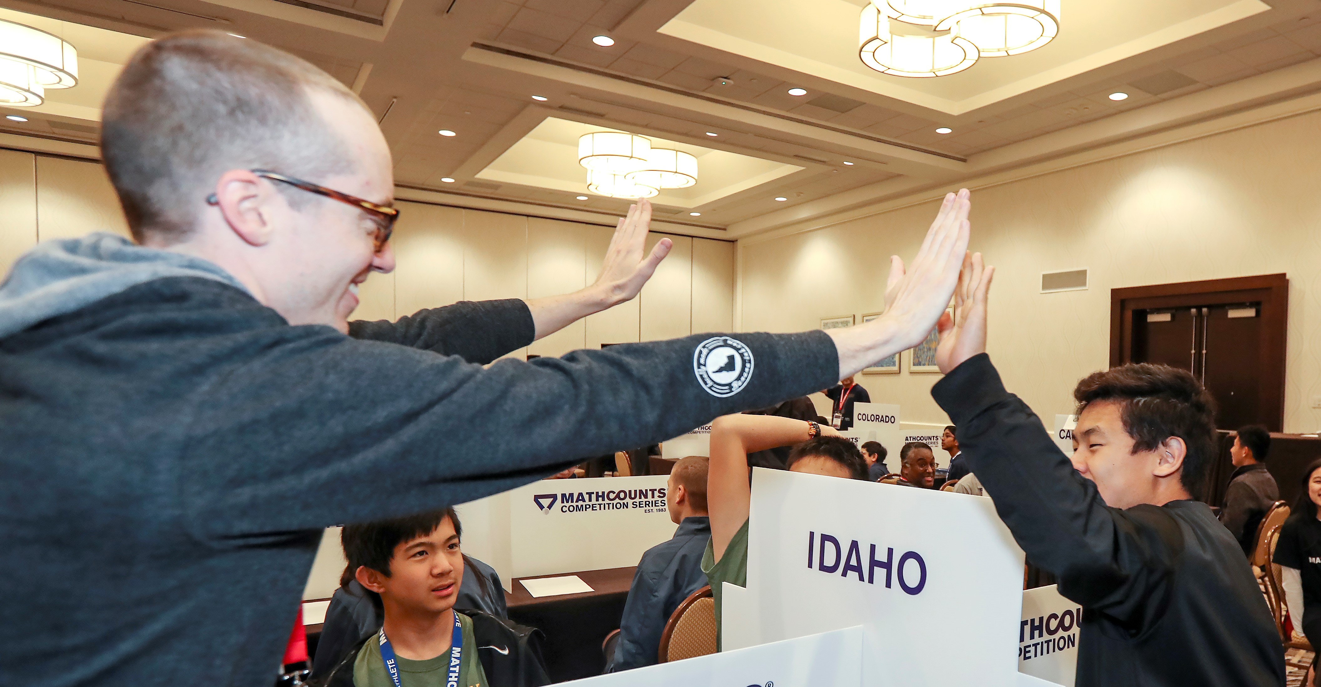 Coach high-fiving Mathlete