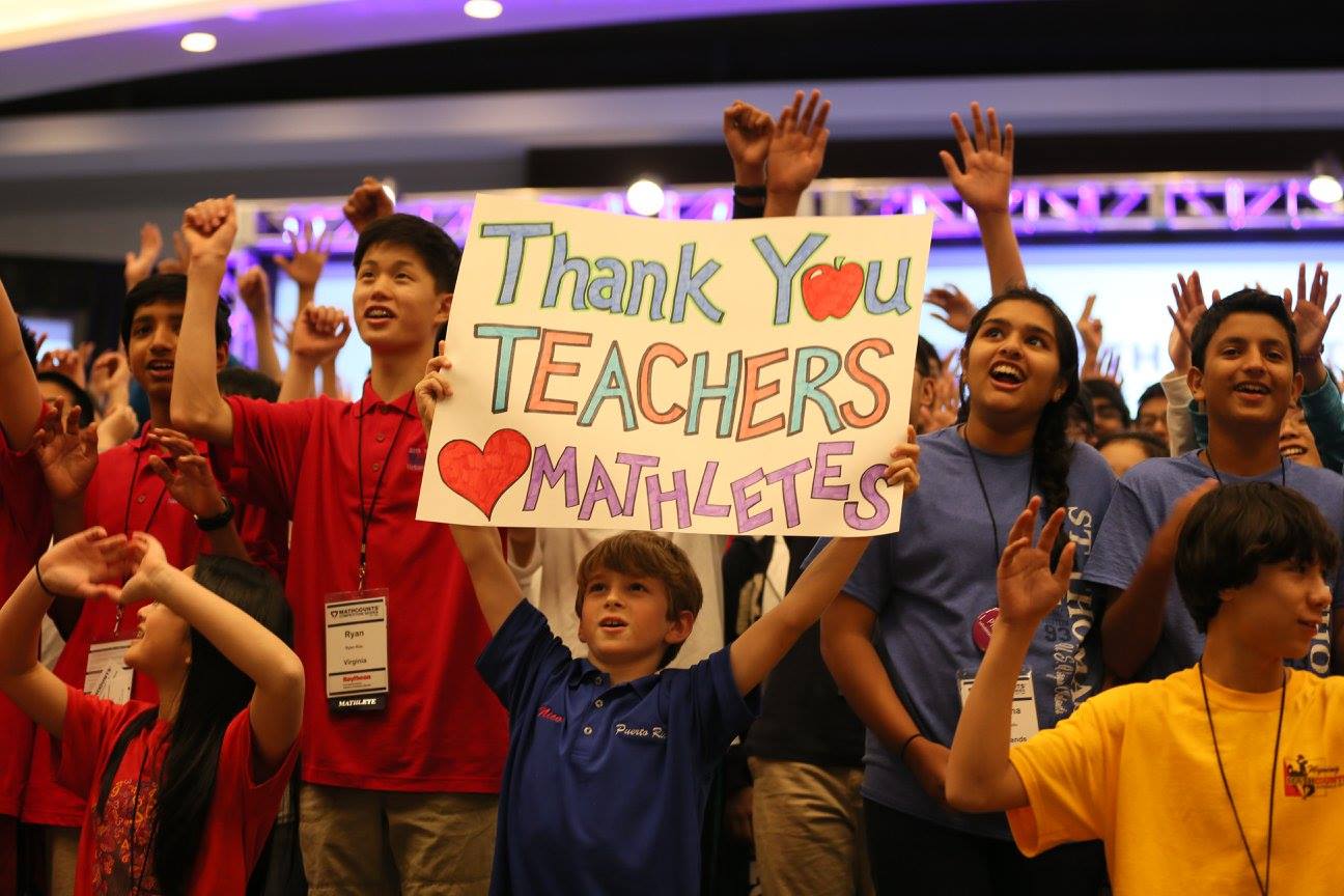 students holding a thank you sign